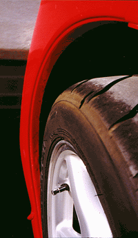 Stock wheel wells from the side view.